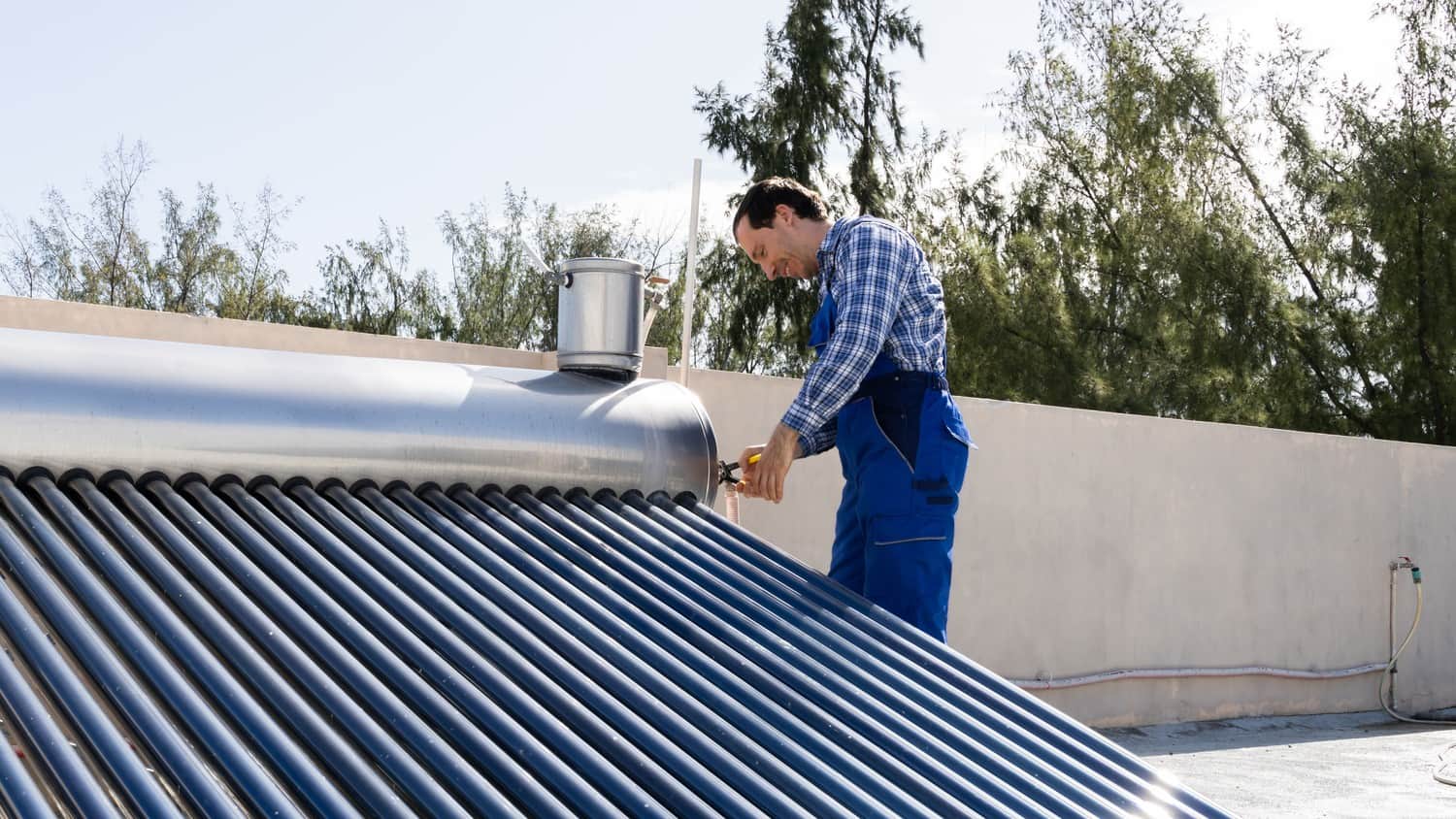 A close-up view of a solar heating system with pipes and panels, capturing the concept of harnessing solar energy for heating purposes.