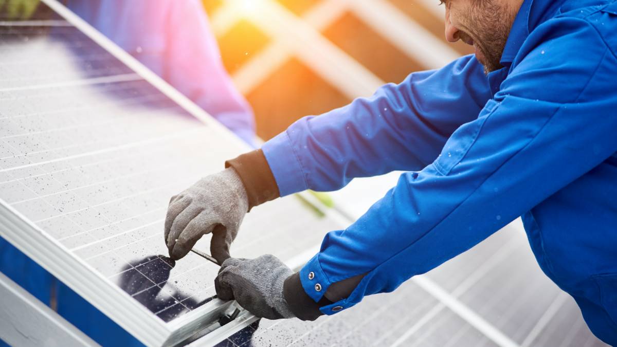 an electrician performing solar panel installation