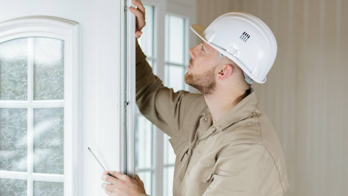 Man installing white door