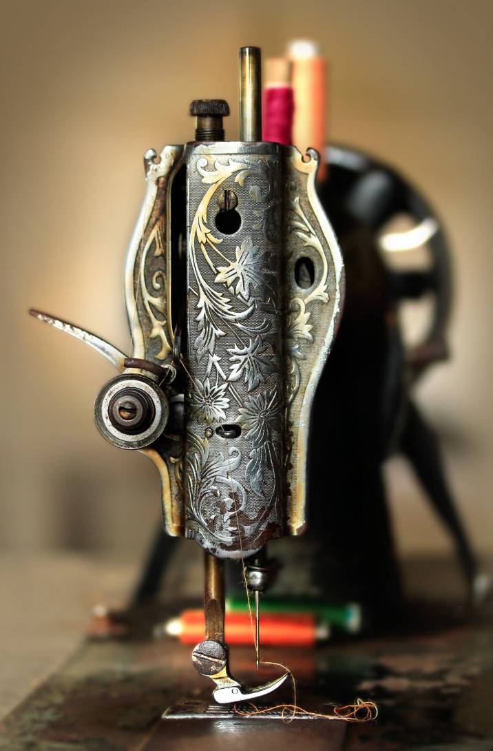 a black sewing machine with a floral design