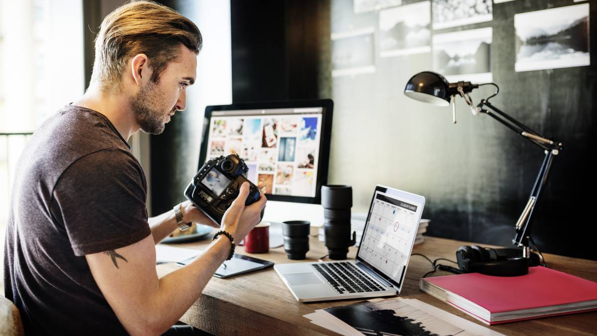 photographer transferring video and photo files in the computer