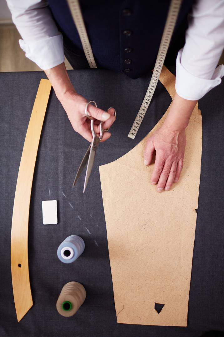 a tailor designing a vest