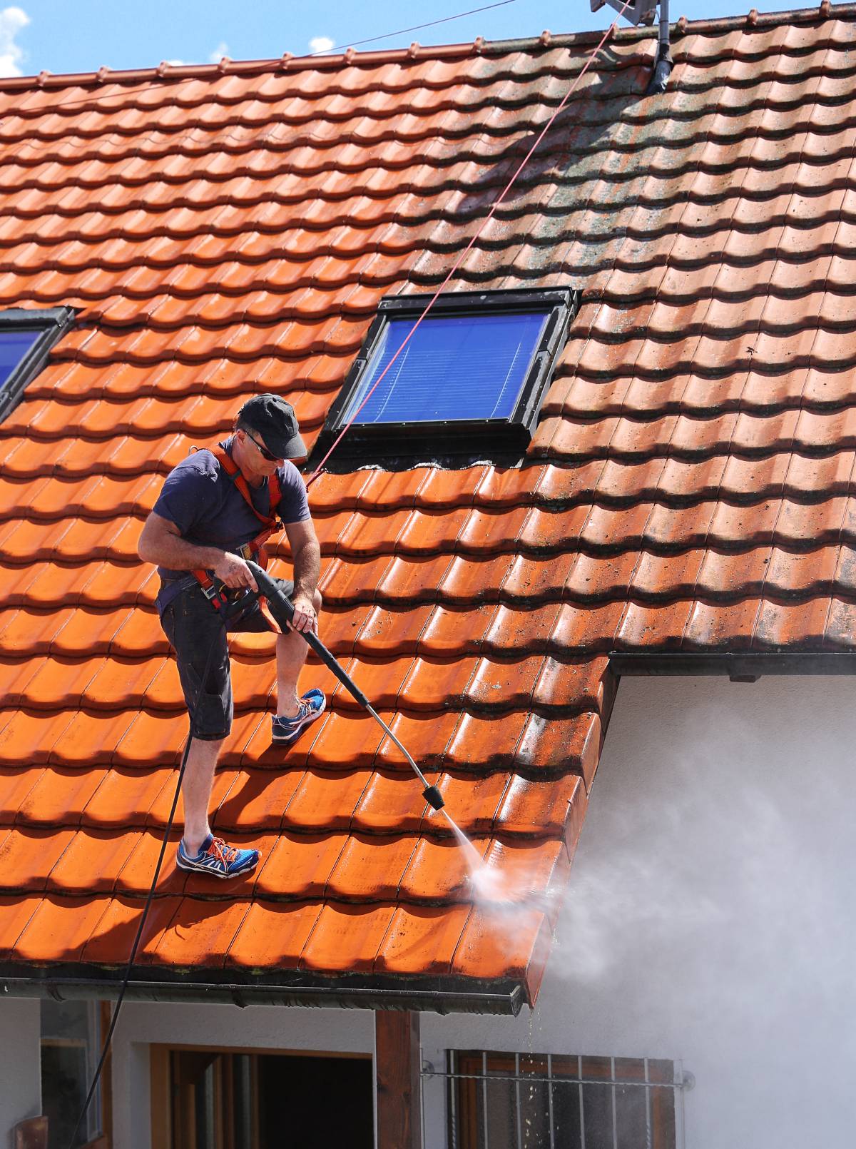 a roof cleaner on the job