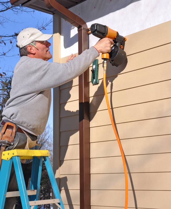 a man installing new siding