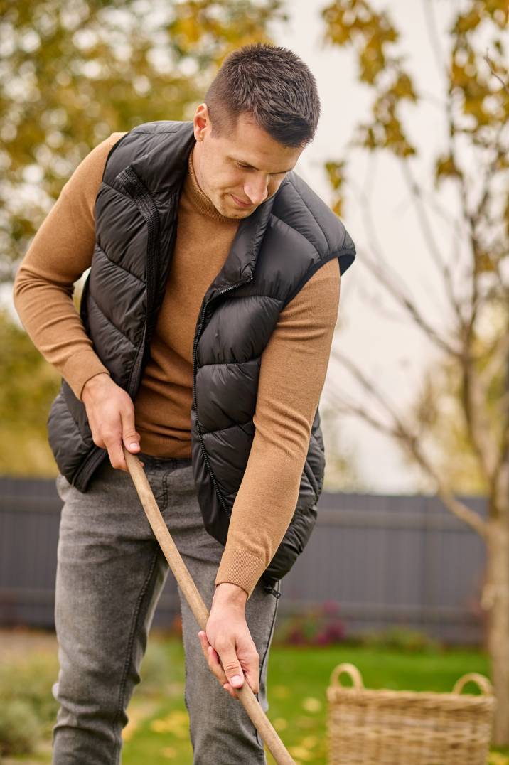 a man cleaning a garden