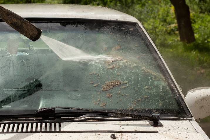 washing mud off a car that was flooded