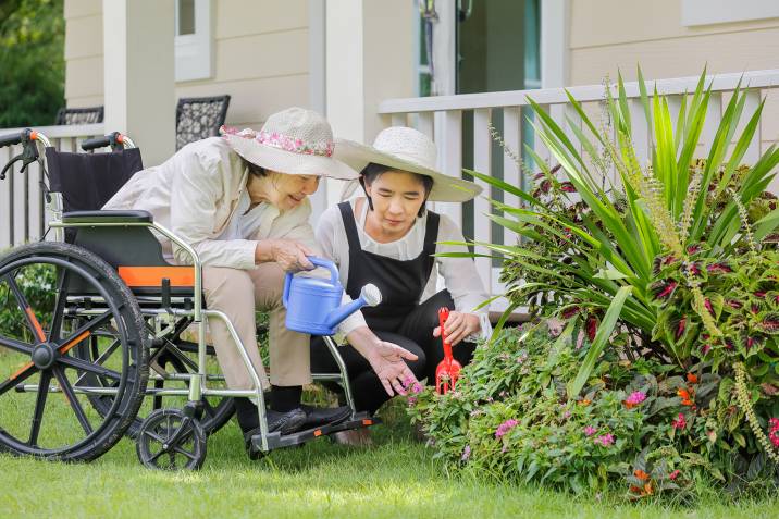 gardener helping elderly person