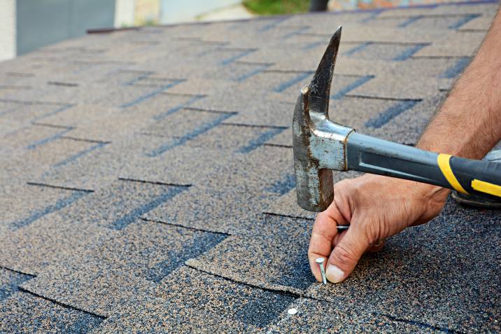 a man repairing a roof