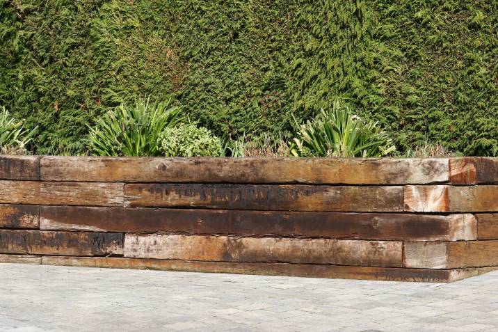 horizontal garden edging made of repurposed sleepers