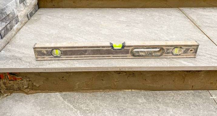 spirit level on garden slabs 