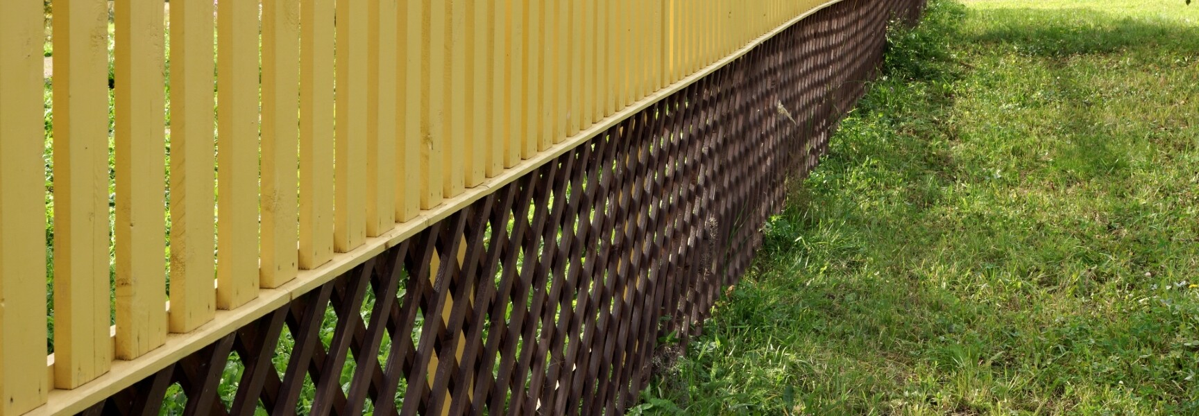 A close-up photo of a lattice pattern, with intersecting lines forming a geometric design.