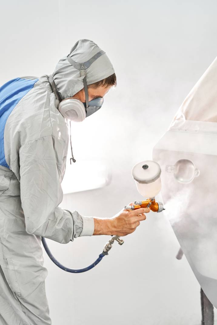 a man respraying a car