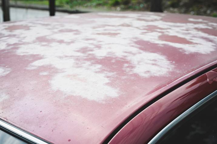 a car hood with fading paint