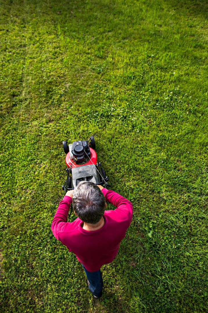 a man mowing a lawn