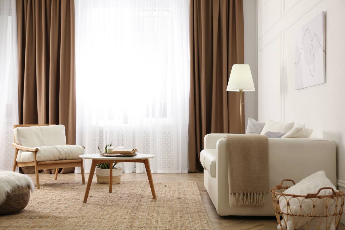 a living room with drapes and curtains