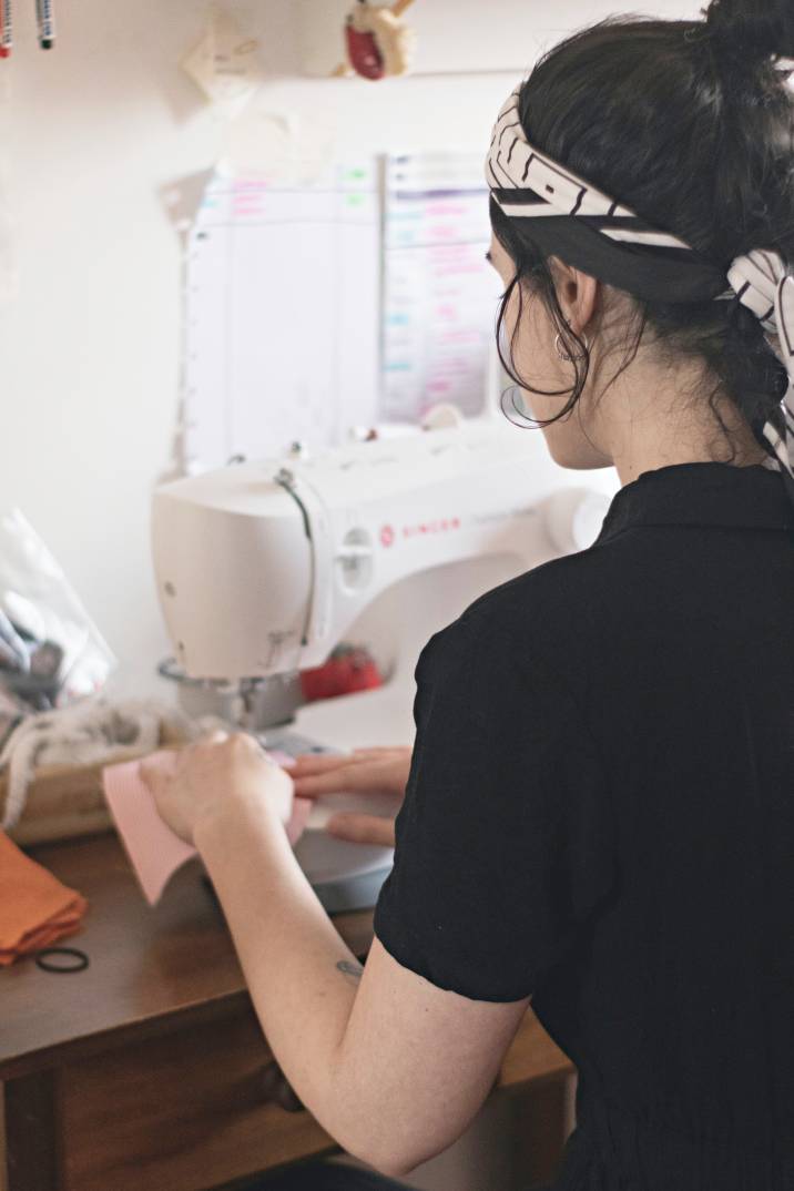 a woman using a sewing machine