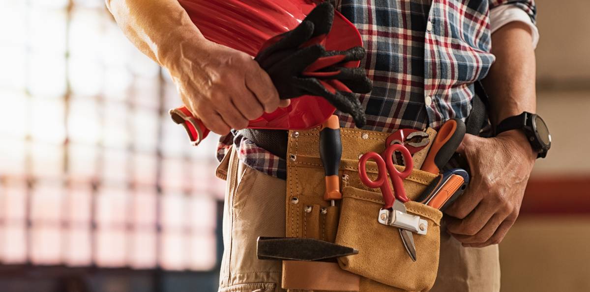 a handyman wearing a tool belt