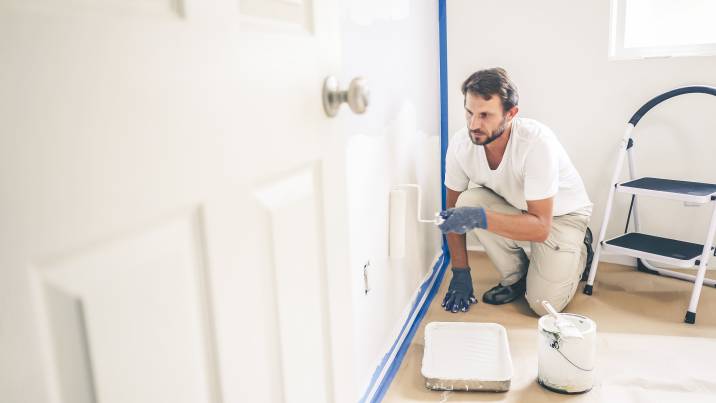 a man painting a wall