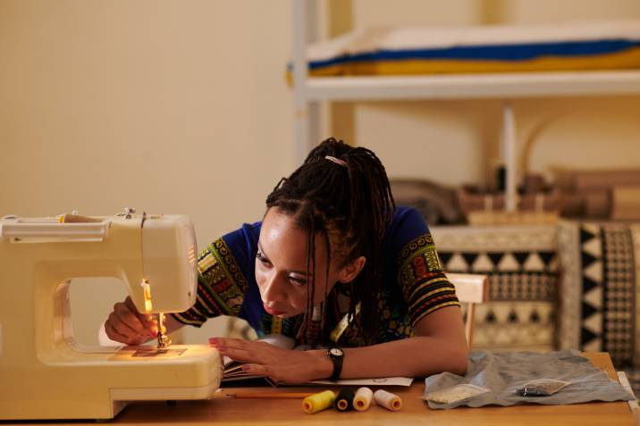 seamstress troubleshooting their sewing machine