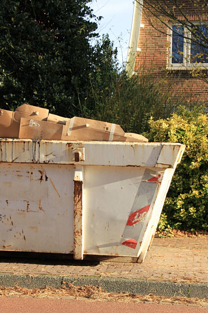 a skip bin full of boxes