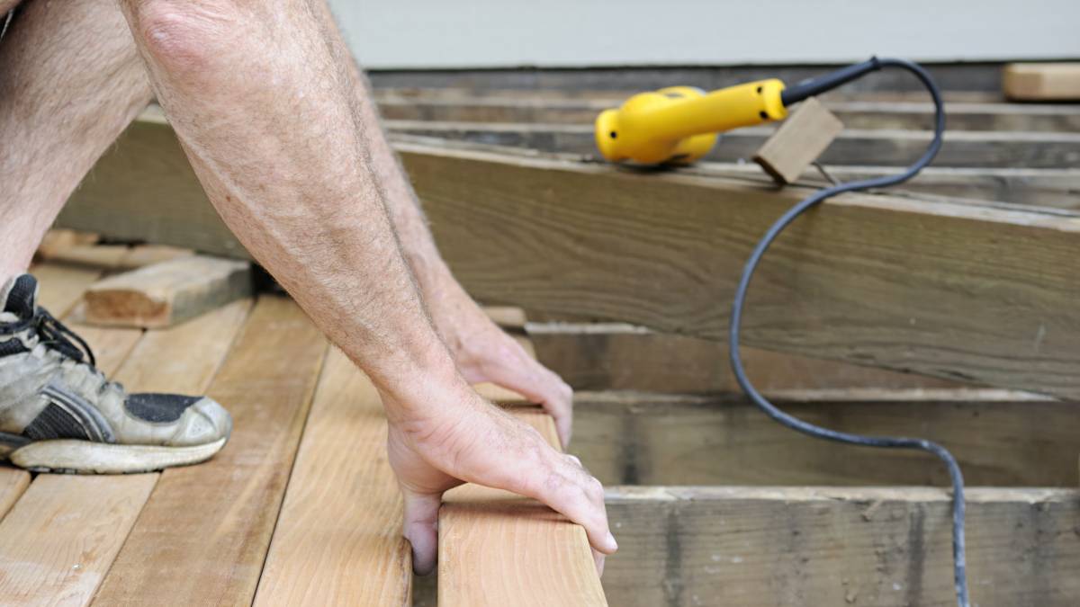 a man building a deck