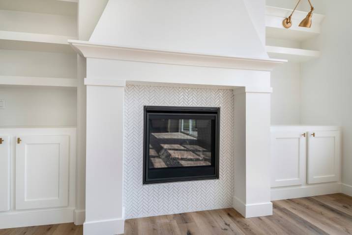 Herringbone tiles empty fireplace