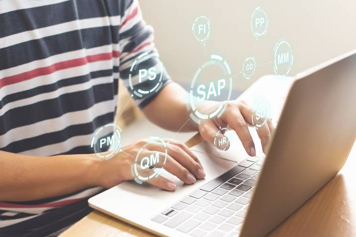 male accountant setting up cloud accounting software on laptop