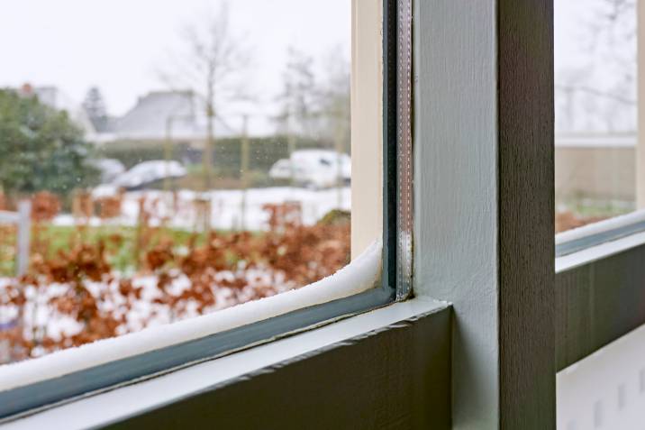 close-up photo of a double glazed window with snow