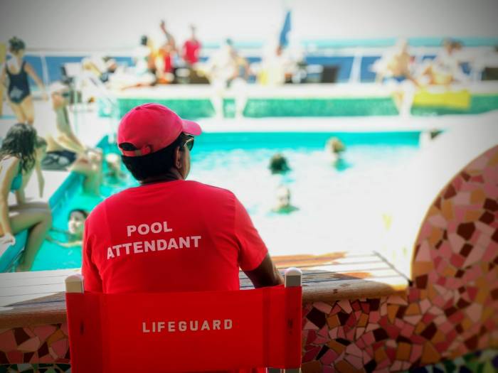 student working as a lifeguard