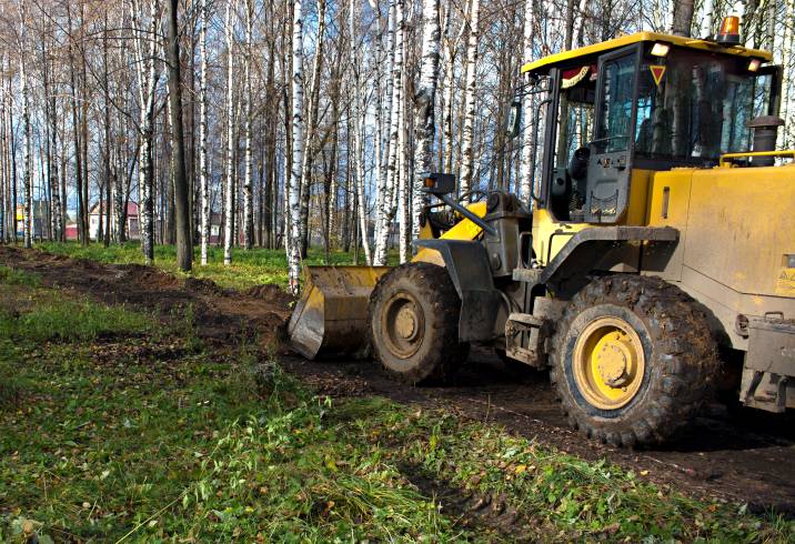 clearing grassy land for new structures