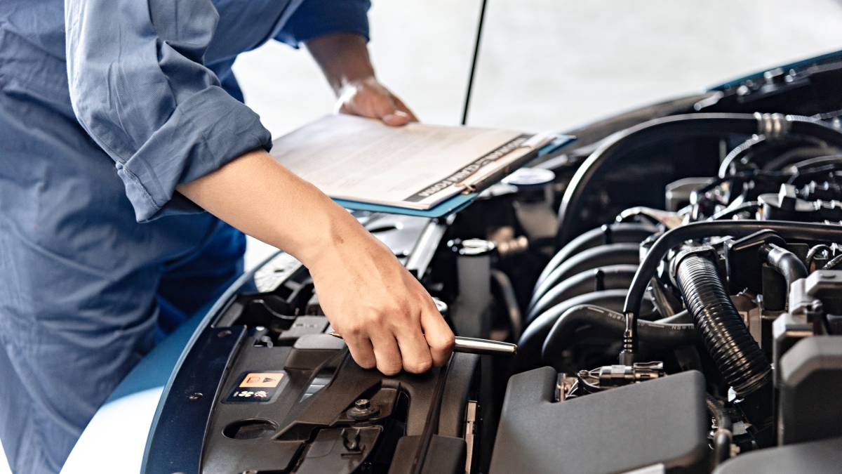 mechanic inspecting a car