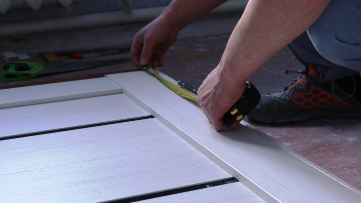 owner marking where the pet door will go