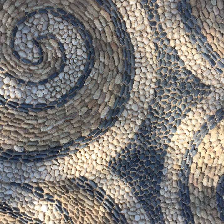 closeup-spiral-stone-mosaic-garden-path