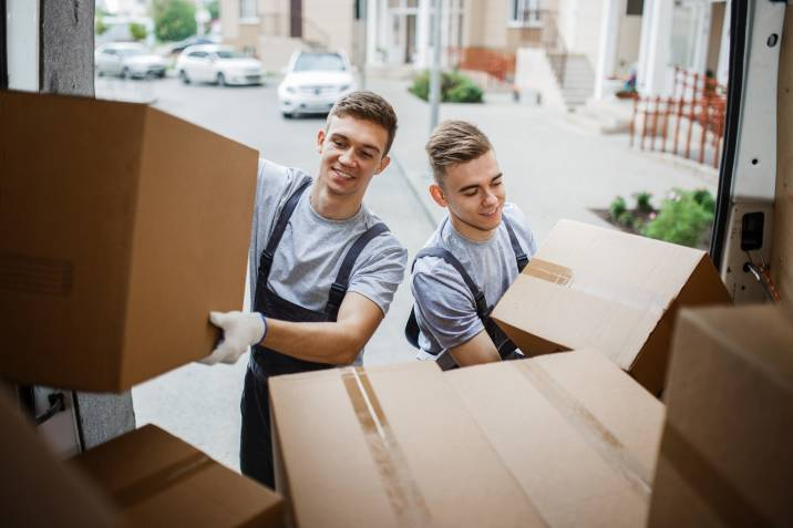 removalists loading a truck with boxes