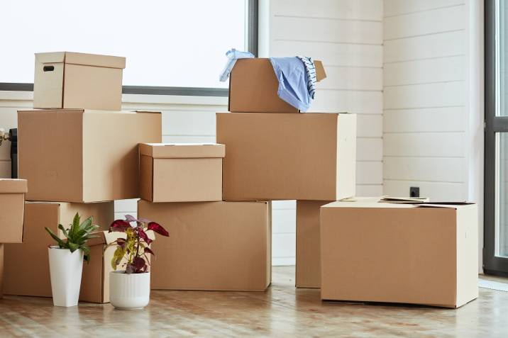 stack of boxes in an empty room