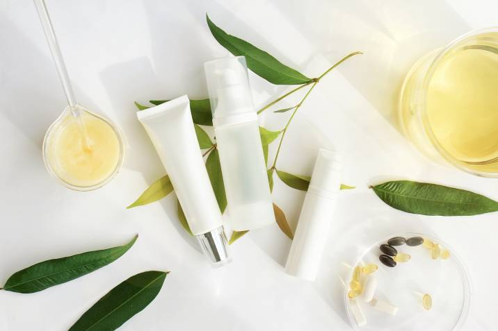 beauty product bottles laid out on a table