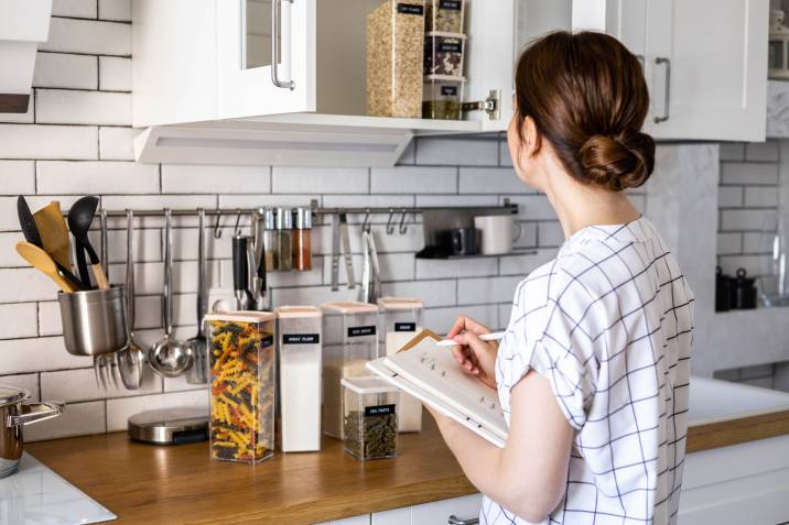 woman organising the kitchen