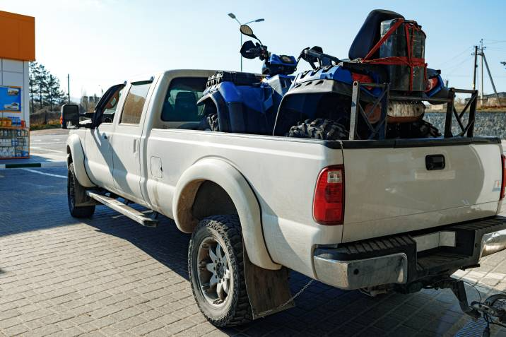 ATV loaded inside a pickup truck