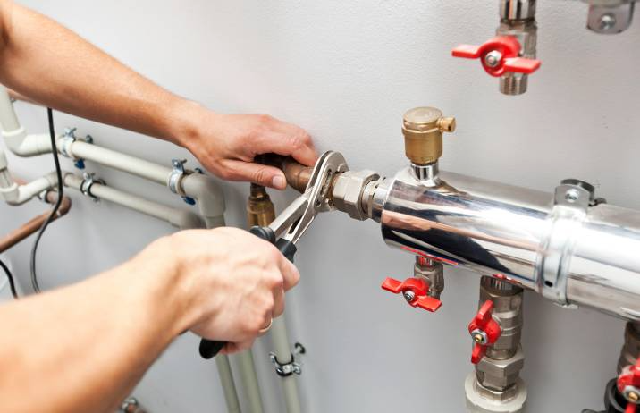 plumber installing a heating system