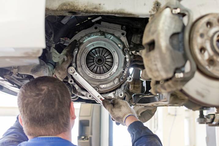 a mechanic replacing a clutch