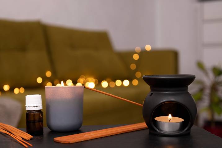 essential oil bottle and candle, cosy living room