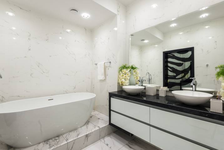 High-gloss paint finish with marble design in modern bathroom