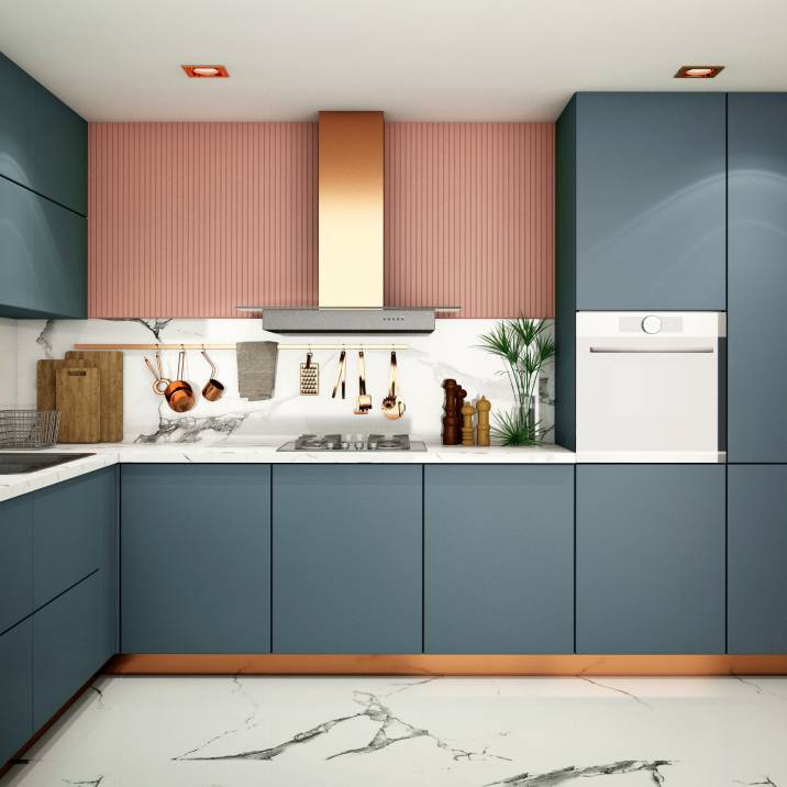 Modern kitchen with blue cabinets and coral-coloured wall accent
