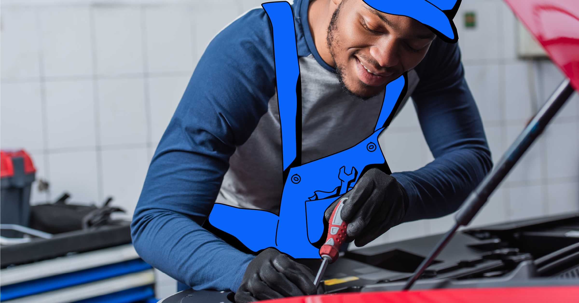 Auto electrician examining a car's electrical system in an automotive workshop.