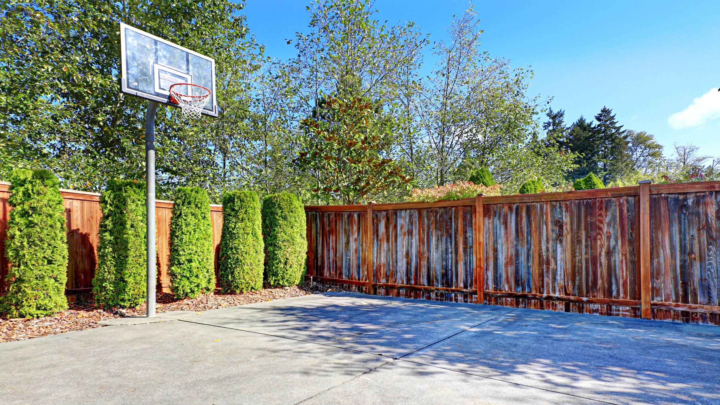 a newly built backyard basketball court