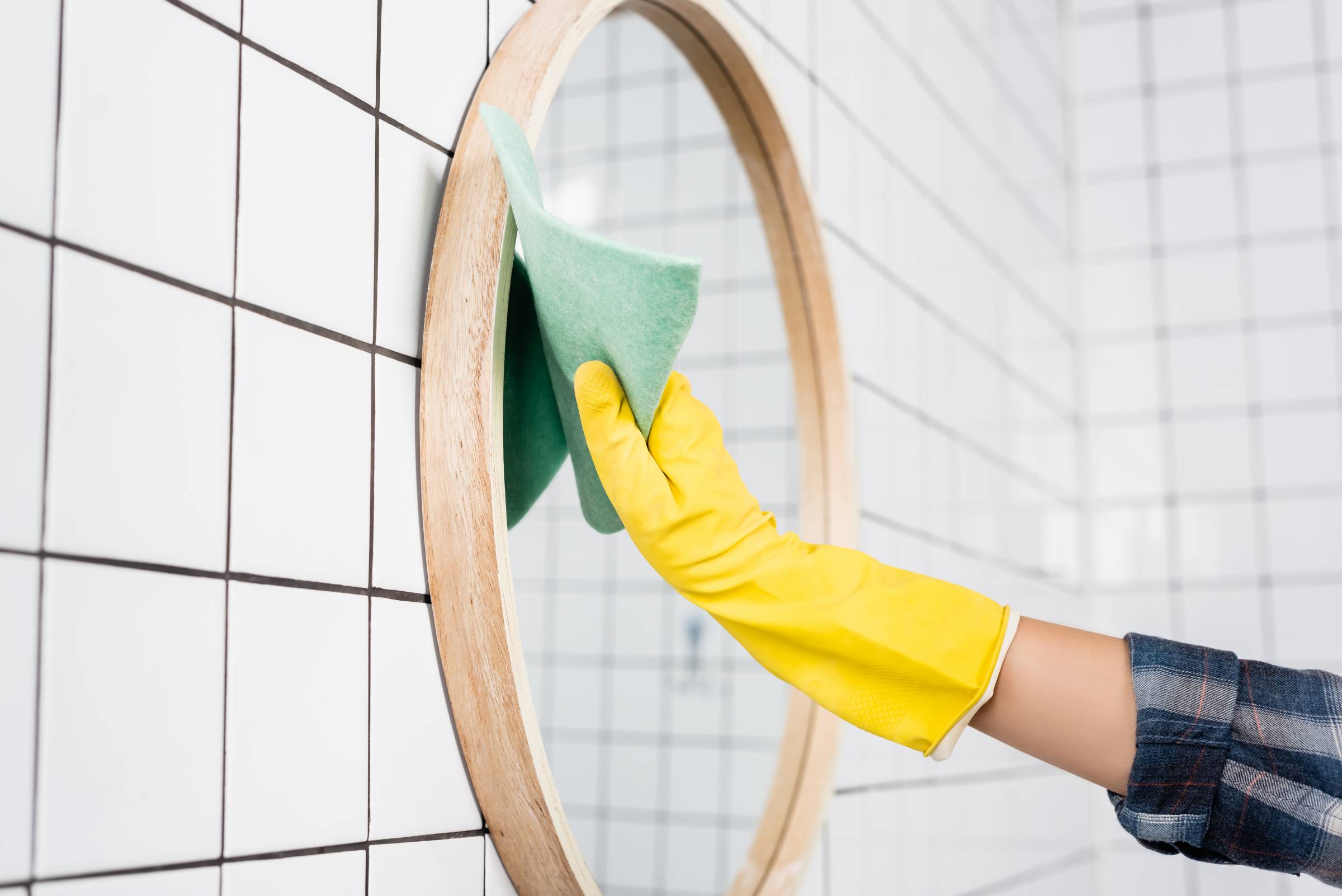 cleaning the bathroom mirror