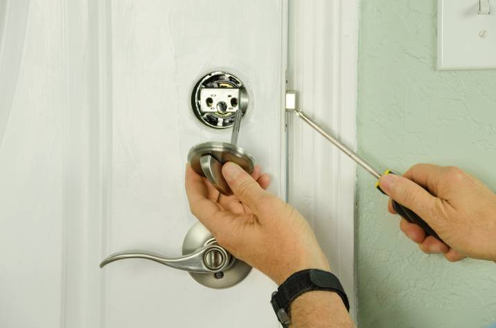 locksmith changing deadbolt lock, security measure after moving into a new home