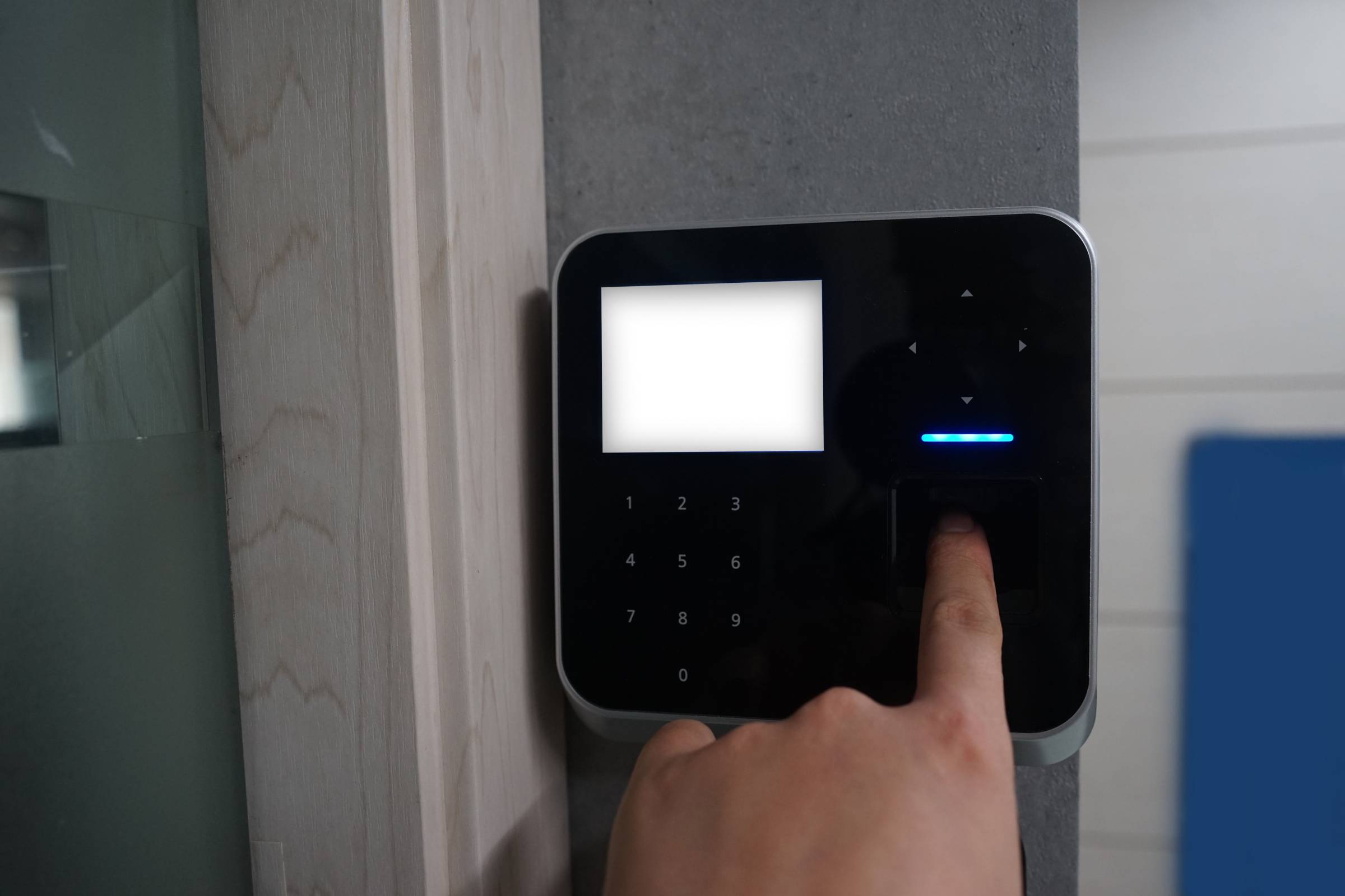 a-man-scanning-their-fingerprint-on-a-smart-security-lock