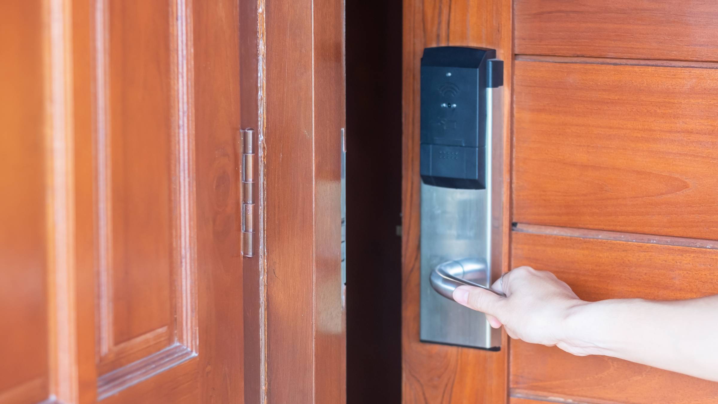 opening the door of a smart digital door lock
