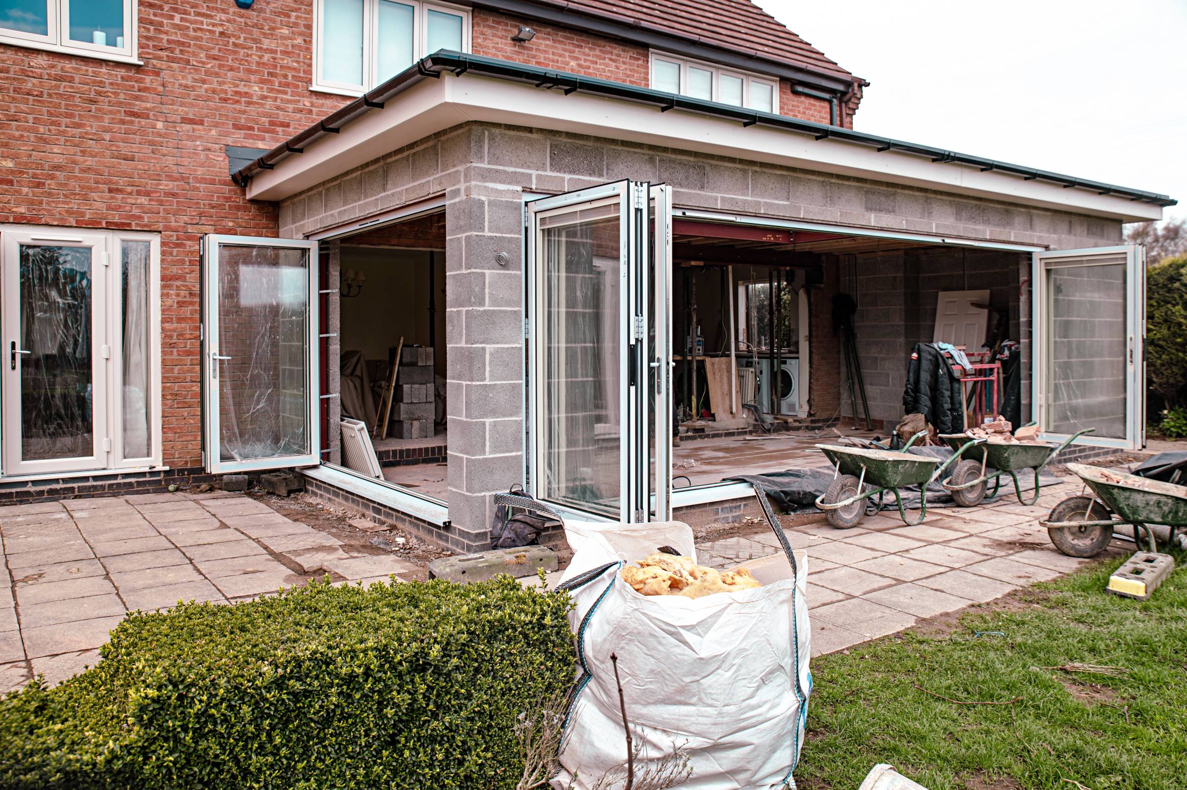 a home extension with open glass doors